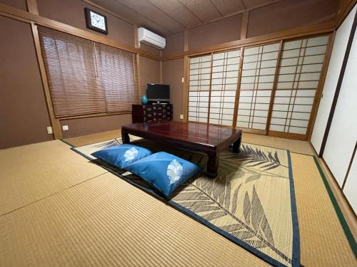 Postel nebo postele na pokoji v ubytování Slowhouse ZUSHI