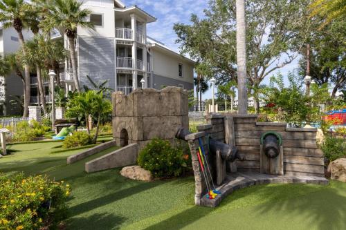 a water fountain in a yard in front of a house at Marriott's Cypress Harbour Villas in Orlando