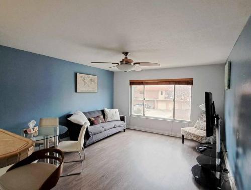 a living room with a couch and a table at 2bdr Bluff Heights Condo walking distance to beach in Long Beach