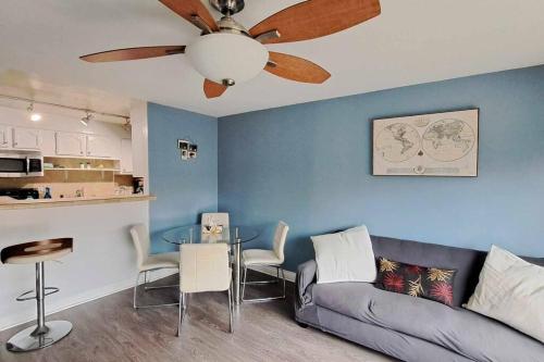 a living room with a couch and a ceiling fan at 2bdr Bluff Heights Condo walking distance to beach in Long Beach