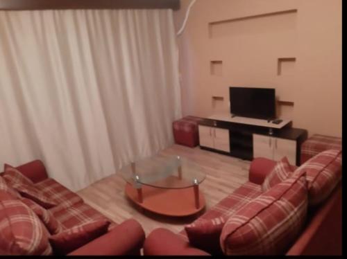 TV a/nebo společenská místnost v ubytování كمبوند ذا ادرس بالشيخ زايد