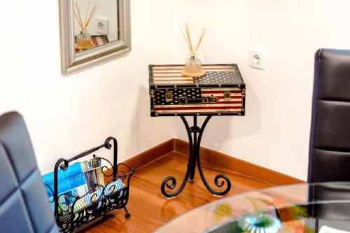 a table with a record player on top of it at Apartments and Rooms Villa Erede in Split