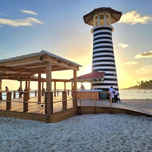 a light house on the beach with a lighthouse at Vibe Residence Hotelstyle NO KITCHEN STUDIO close to beach in La Laguna