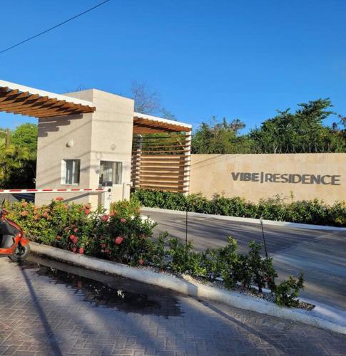 a building with a sign on the side of a street at Vibe Residence Hotelstyle NO KITCHEN STUDIO close to beach in La Laguna