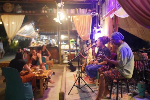 a group of people sitting in a room with a microphone at KRABI BAMBOO KINGDOM at AOLUEK PARADISE in Ao Luk