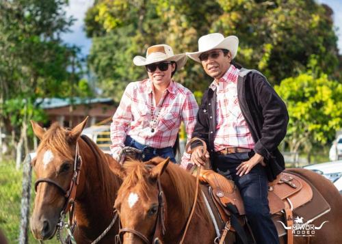 a man and a woman are riding on horses at Alto Quiel Country in Alto Quiel