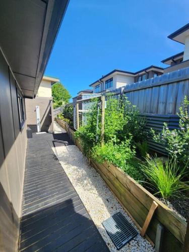 a stairway leading to a house with a fence at Rosebud Retro Retreat in Rosebud