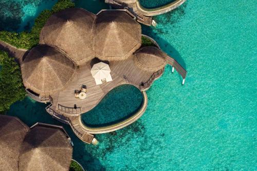 an aerial view of a resort in the water at The Nautilus Maldives in Baa Atoll