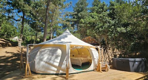 a white tent sitting on a wooden deck at Glamping de Matanzas in Matanzas