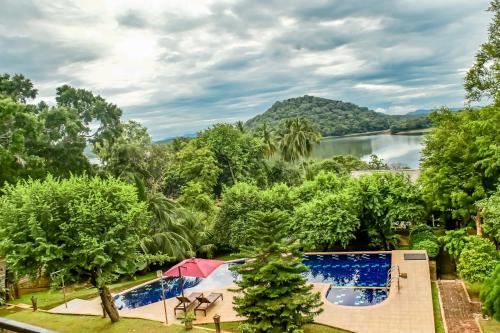 an image of a resort with a view of a lake at Agbo Hotel in Polonnaruwa