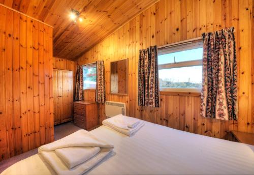 Krevet ili kreveti u jedinici u okviru objekta Lagnakeil Highland Lodges