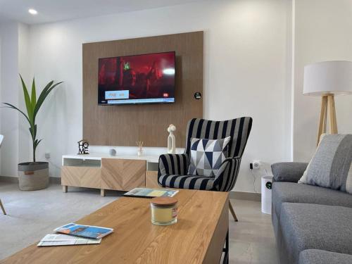a living room with a couch and a table at Cabosun in El Cabo de Gata