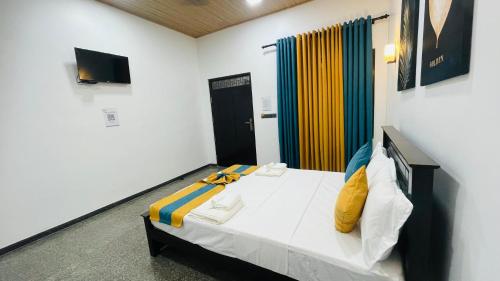 a bedroom with a bed in a room at The Sanctum in Talaimannar