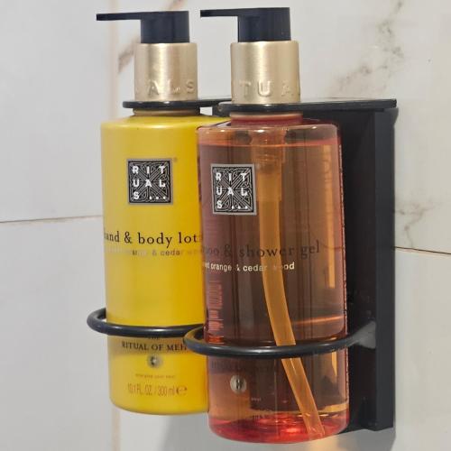 three bottles of essential oils in a black box at Plitvice Falls Cottage in Plitvica selo