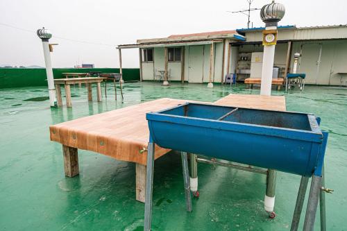 a blue box sitting on top of a table in the water at Daebudo Hue Motel in Ansan