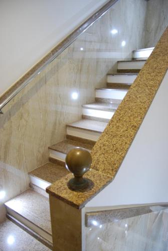 a set of stairs with a gold ball on them at Pousada Bahia Pelô in Salvador