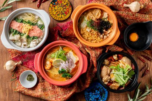 a group of bowls of food on a table at ホテル ブルジュア 久留米 Hotel Bvljua -レジャーホテル- in Kurume