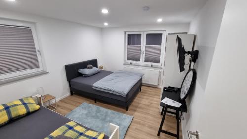 Katil atau katil-katil dalam bilik di Wohnung am Weinberg Ahnatal