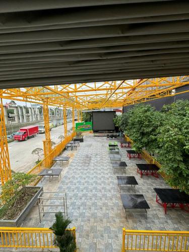 an overhead view of a greenhouse with benches and a screen at Sunny Garden Riverside Hotel Ninh Binh in Ninh Binh