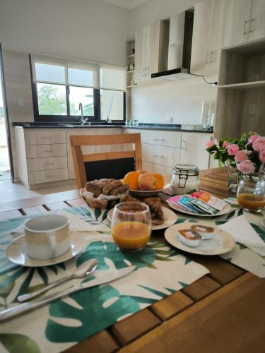 a kitchen with a table with food on it at La Estación A in Reconquista