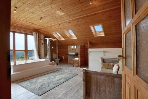 a bedroom with a bed and a tub in a room at Natural Home Tarifa in Tarifa