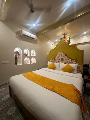 a bedroom with a large bed in a room at Stay Banaras - A Boutique Hotel in Varanasi