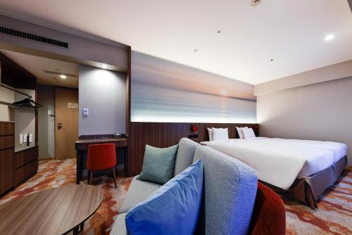 Postel nebo postele na pokoji v ubytování Miyako Hotel Yokkaichi