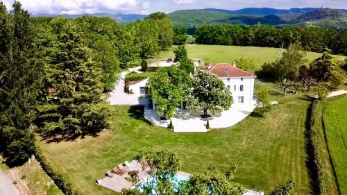 an aerial view of a large house in a field at Domaine de Bonaveau - Spa & Piscine in Barcelonne