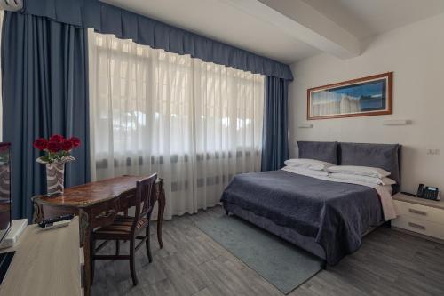 Кровать или кровати в номере Hotel Giulietta e Romeo