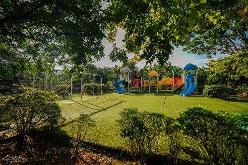 a park with a playground with a slide at The Grand Mountain Hotel in Matale