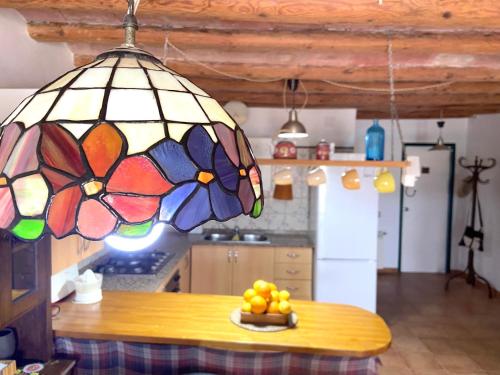 a stained glass chandelier in a kitchen with a table at LA CASA DE LA PARRA in Ulldecona