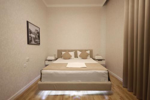 Postel nebo postele na pokoji v ubytování IDEAL Hotel