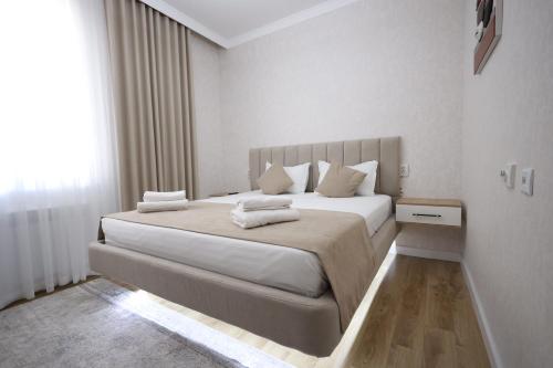 Postel nebo postele na pokoji v ubytování IDEAL Hotel
