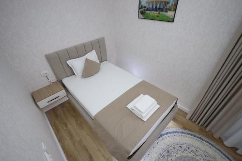 Postel nebo postele na pokoji v ubytování IDEAL Hotel