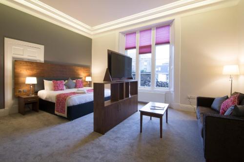 Кровать или кровати в номере Court Residence Aparthotel