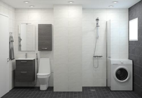 Un baño con inodoro y lavadora. en Villa Ruths Stay Torni, en Kouvola