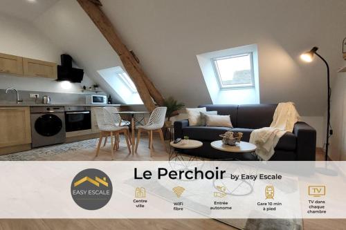 a living room with a couch and a table at Le Perchoir - EasyEscale in Nogent-sur-Seine