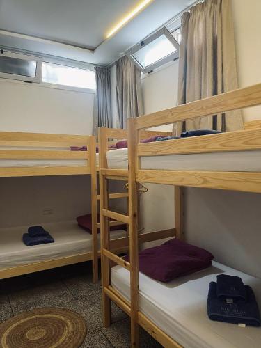 a group of bunk beds in a room at BIG BLUE guest house in Imsouane