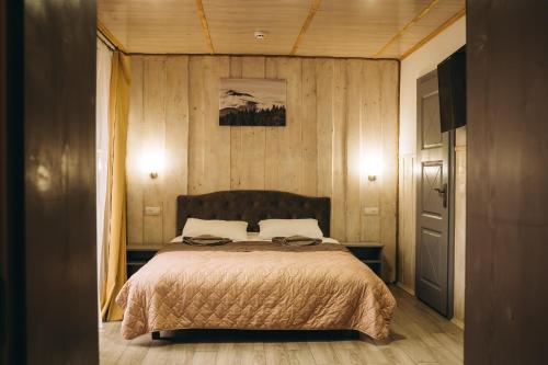 a bedroom with a bed in a room at SV HOTEL&camp in Lazeshchyna