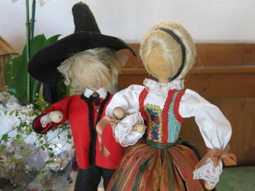 two dolls dressed in costumes standing next to each other at Digonera Historic Hotel B&B in Rocca Pietore