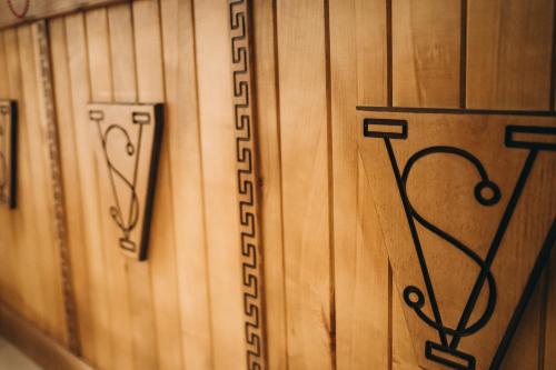a close up of wood panels with the word inventory at SV HOTEL&camp in Lazeshchyna