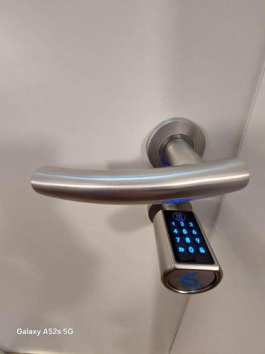 a remote control hanging from a door handle at Hotel Radevormwald in Radevormwald