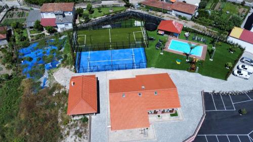 an aerial view of a house with a swimming pool at Belo Encanto in Felgueiras
