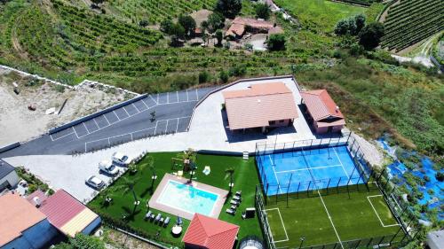 an aerial view of a house with a swimming pool at Belo Encanto in Felgueiras