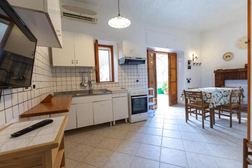 Kuchyň nebo kuchyňský kout v ubytování B&B Villa Passiaturo