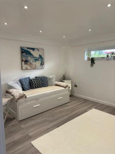 a white living room with a couch in a room at Devonshire - 1 Bedroom Apartment with Full Amenities in Preston