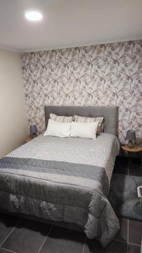 Ένα ή περισσότερα κρεβάτια σε δωμάτιο στο Quinta' Home