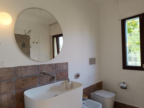 a bathroom with a sink and a mirror at B & B Villa Flora in Mondello