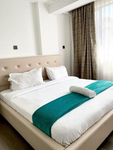 Ένα ή περισσότερα κρεβάτια σε δωμάτιο στο City Oasis, 1 Bedroom