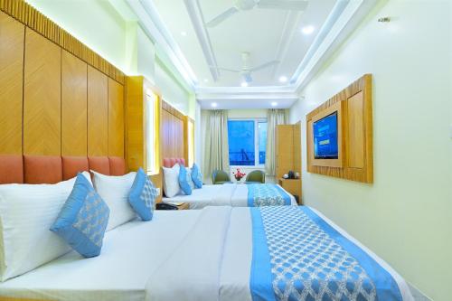 Katil atau katil-katil dalam bilik di Northern palace - 1 Min From Connaught Place & New Delhi Railway Station